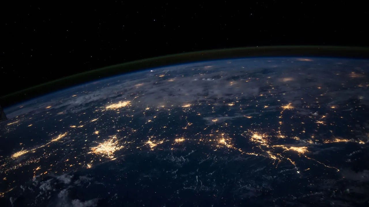A glowing network of connections across a dark globe — strangers meeting across the world on random video chat