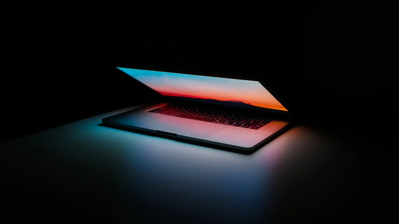 A laptop open at night — the browser-tab setup behind an adults-only random video chat instead of a youth app